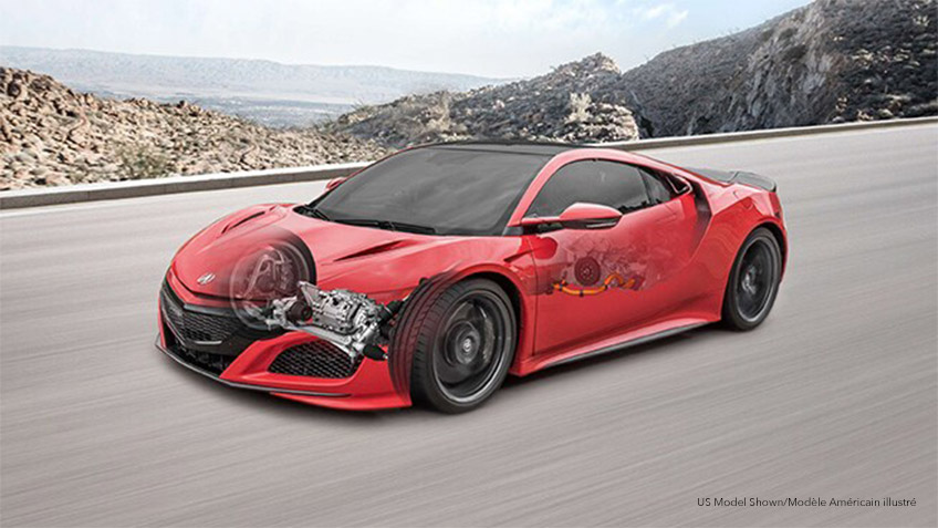 A red Acura NSX driving cliff-side. Its Sport-Hybrid All-Wheel Drive system is visible. / Une Acura NSX rouge longeant une falaise. Son système de traction intégrale Sport Hybrid est visible.