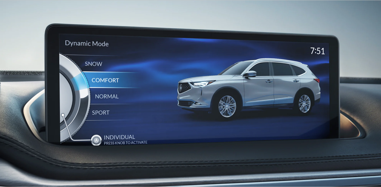 Close-up of the navigation screen in an Acura MDX displaying the different drive modes available to the driver. The mode “COMFORT” is selected and highlighted blue. Gros plan de l’écran de navigation d’un Acura MDX affichant les différents modes de conduite offerts au conducteur. Le mode « COMFORT » est sélectionné et mis en évidence en bleu.